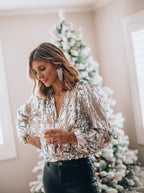 Women's sequin puff sleeve top in black, featuring long sleeves and a stylish evening blouse design, perfect for formal events and parties. 1