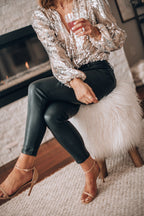 Women's sequin puff sleeve top in black, featuring long sleeves and a stylish evening blouse design, perfect for formal events and parties. 4