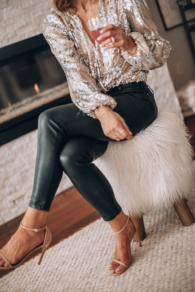 Women's sequin puff sleeve top in black, featuring long sleeves and a stylish evening blouse design, perfect for formal events and parties. 4