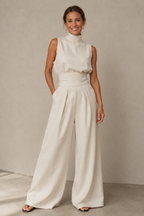 Women's sleeveless wide leg jumpsuit in a stylish design, perfect for casual spring and summer wear, featuring lightweight fabric and a comfortable fit. 1