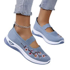 Women's slip-on sneakers featuring a casual comfort design with a vibrant floral pattern, perfect for everyday wear and stylish outings. 0