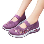 Women's slip-on sneakers featuring a casual comfort design with a vibrant floral pattern, perfect for everyday wear and stylish outings. 1