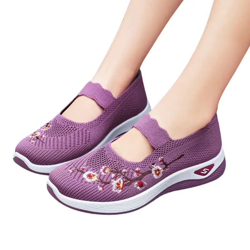 Women's slip-on sneakers featuring a casual comfort design with a vibrant floral pattern, perfect for everyday wear and stylish outings. 1