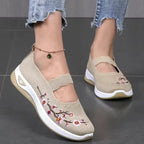 Women's slip-on sneakers featuring a casual comfort design with a vibrant floral pattern, perfect for everyday wear and stylish outings. 10