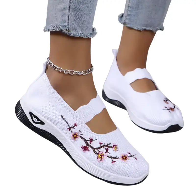 Women's slip-on sneakers featuring a casual comfort design with a vibrant floral pattern, perfect for everyday wear and stylish outings. 12