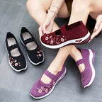 Women's slip-on sneakers featuring a casual comfort design with a vibrant floral pattern, perfect for everyday wear and stylish outings. 2