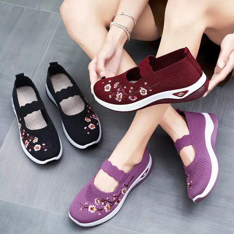 Women's slip-on sneakers featuring a casual comfort design with a vibrant floral pattern, perfect for everyday wear and stylish outings. 2
