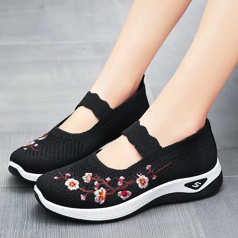 Women's slip-on sneakers featuring a casual comfort design with a vibrant floral pattern, perfect for everyday wear and stylish outings. 4