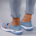 Women's slip-on sneakers featuring a casual comfort design with a vibrant floral pattern, perfect for everyday wear and stylish outings. 5