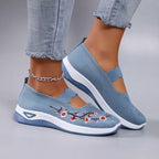 Women's slip-on sneakers featuring a casual comfort design with a vibrant floral pattern, perfect for everyday wear and stylish outings. 6