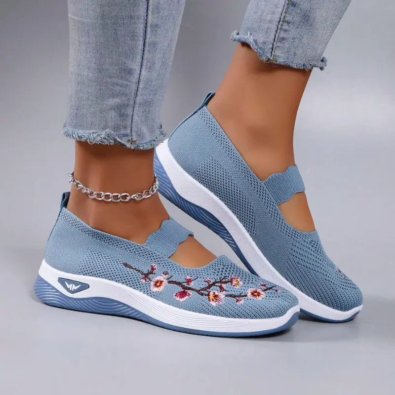 Women's slip-on sneakers featuring a casual comfort design with a vibrant floral pattern, perfect for everyday wear and stylish outings. 6
