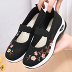 Women's slip-on sneakers featuring a casual comfort design with a vibrant floral pattern, perfect for everyday wear and stylish outings. 7