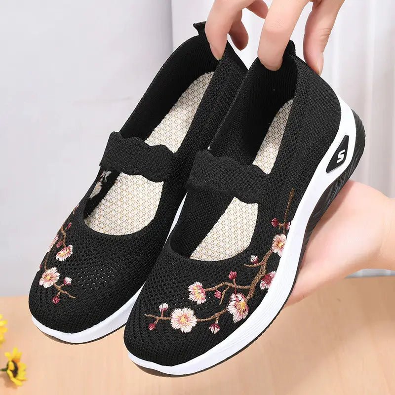 Women's slip-on sneakers featuring a casual comfort design with a vibrant floral pattern, perfect for everyday wear and stylish outings. 7