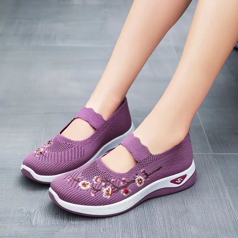 Women's slip-on sneakers featuring a casual comfort design with a vibrant floral pattern, perfect for everyday wear and stylish outings. 8