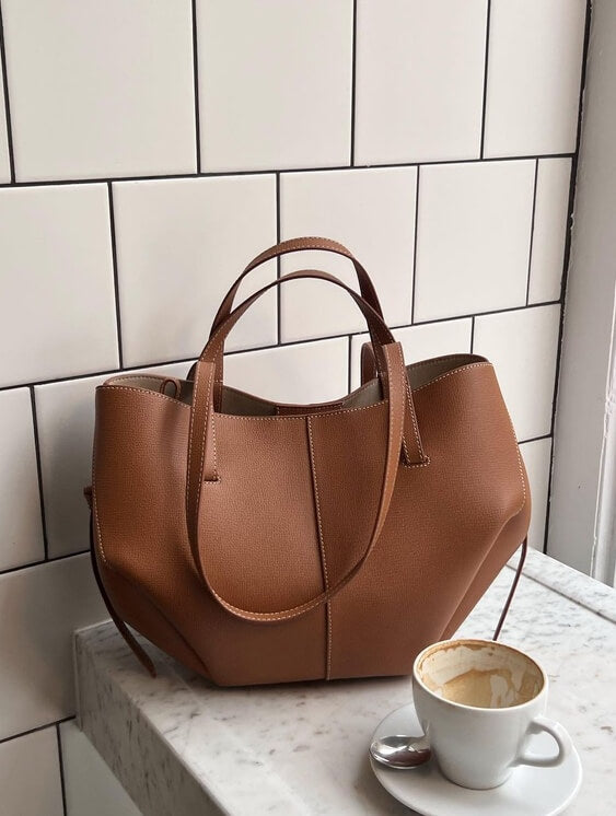 Women's vintage leather tote bag featuring a spacious design, perfect for office use, shopping, and day trips. 0