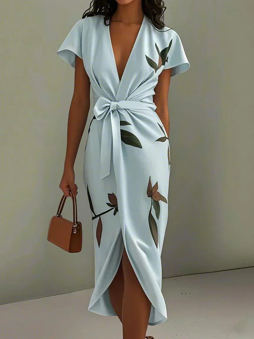 Plus size women's wrap dress featuring a tie waist, designed for formal summer occasions, showcasing a flattering silhouette and elegant style. 2