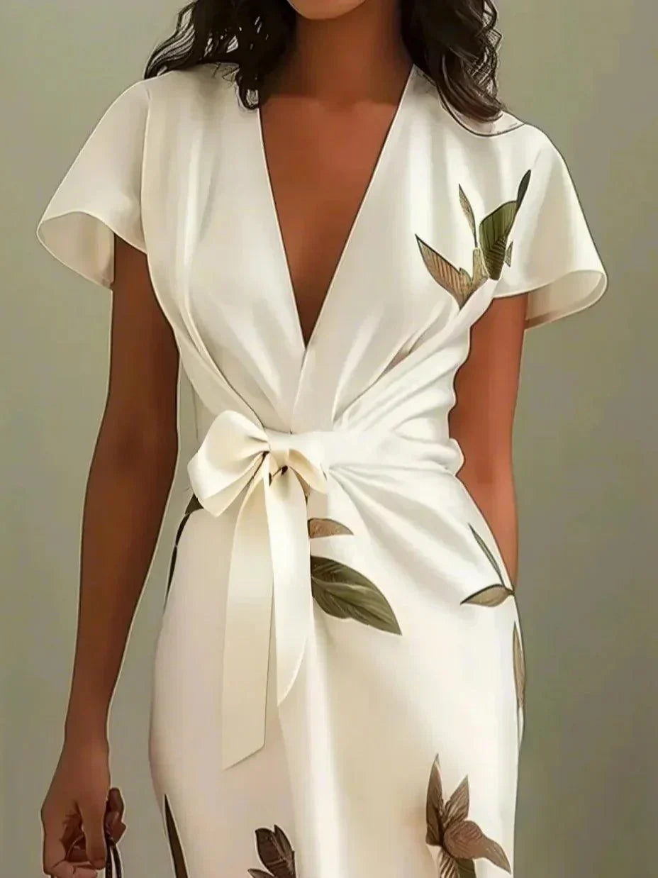 Plus size women's wrap dress featuring a tie waist, designed for formal summer occasions, showcasing a flattering silhouette and elegant style. 3