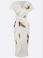 Plus size women's wrap dress featuring a tie waist, designed for formal summer occasions, showcasing a flattering silhouette and elegant style. 5